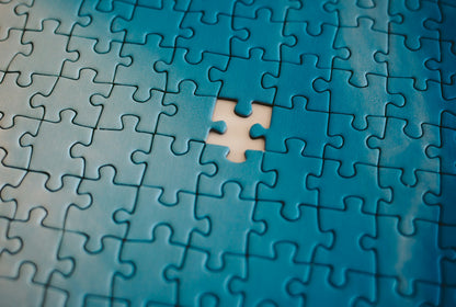Close-up of jigsaw puzzle showing the final missing piece [unsplash:cWMhxNmQVq0]